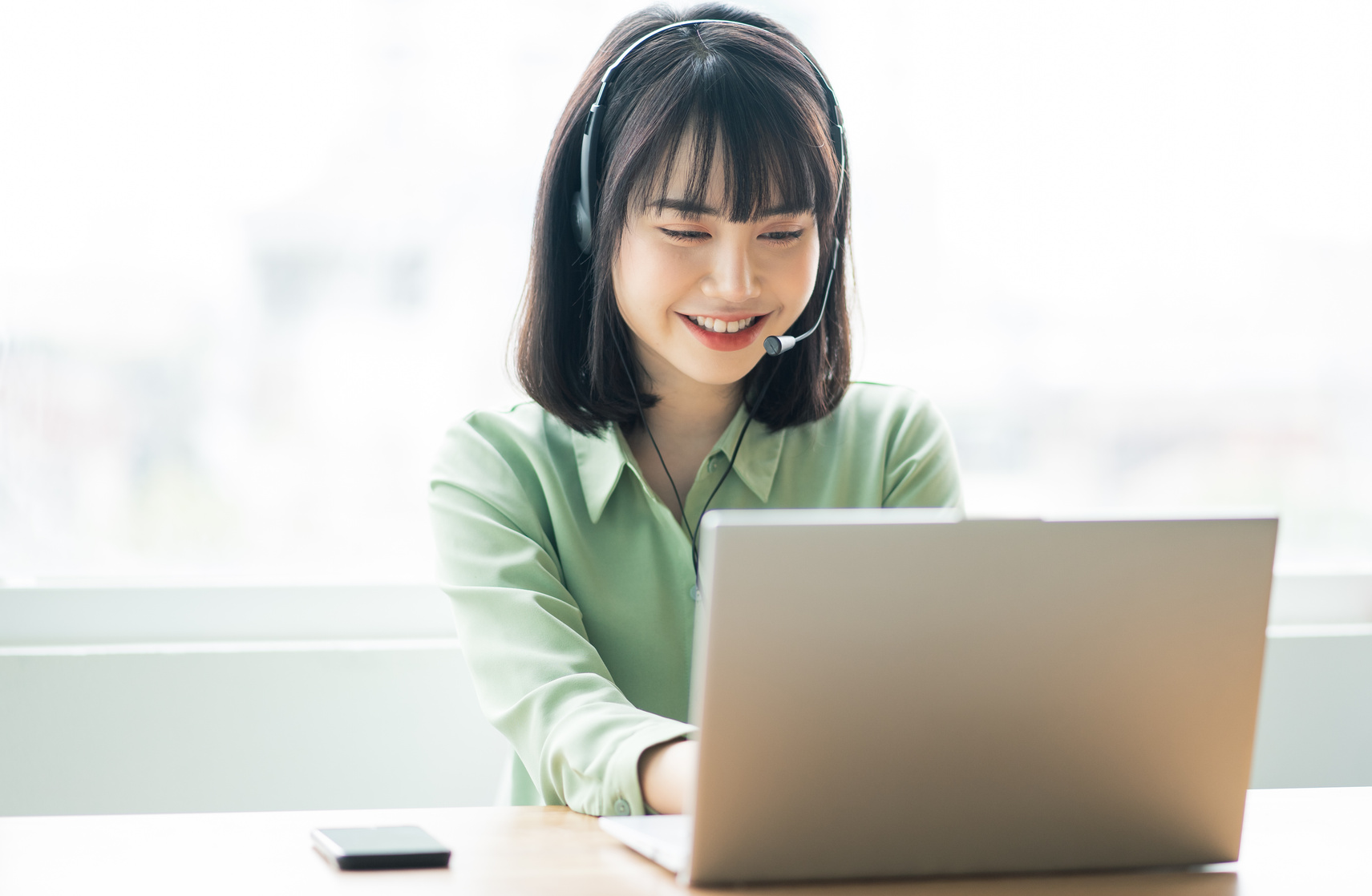 Beautiful Asian Customer Service Lady Is Calling Customers to Offer Products